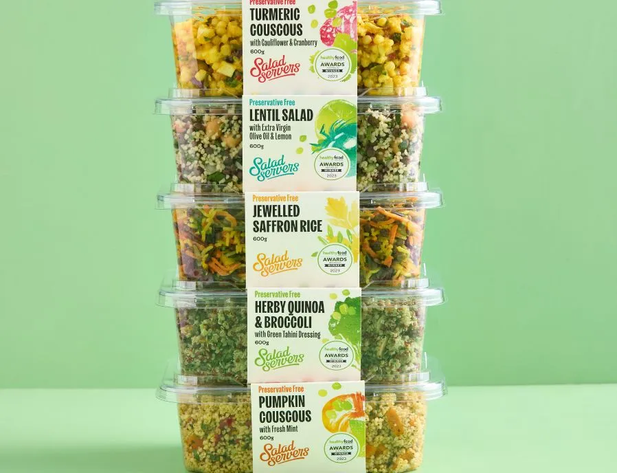 A stack of Salad Servers salad tubs including Lentil Salad and Pumpkin Couscous