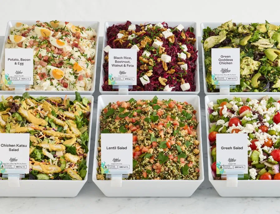 Bulk bowls of Salad Servers salads ready for the deli counter