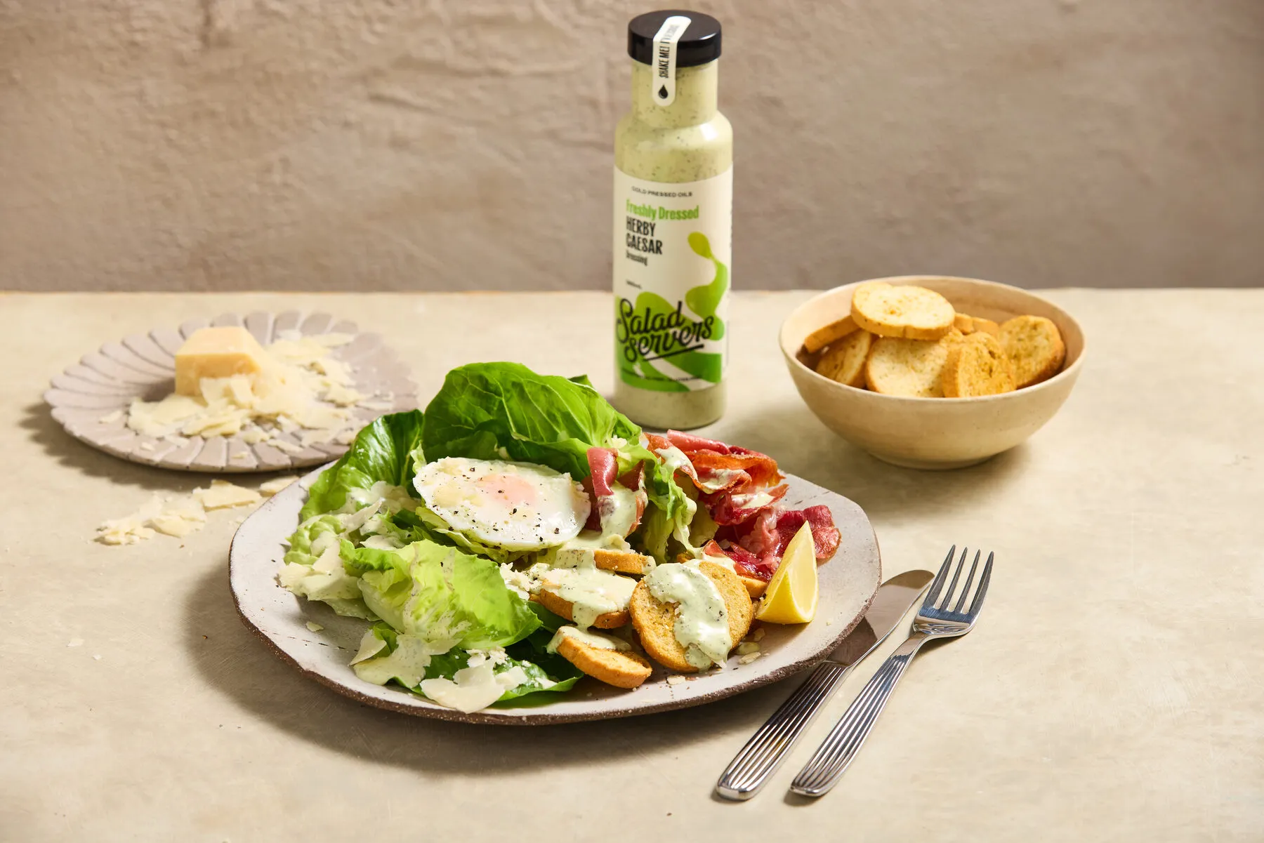 Herby Caesar dressing drizzled over a fresh dish