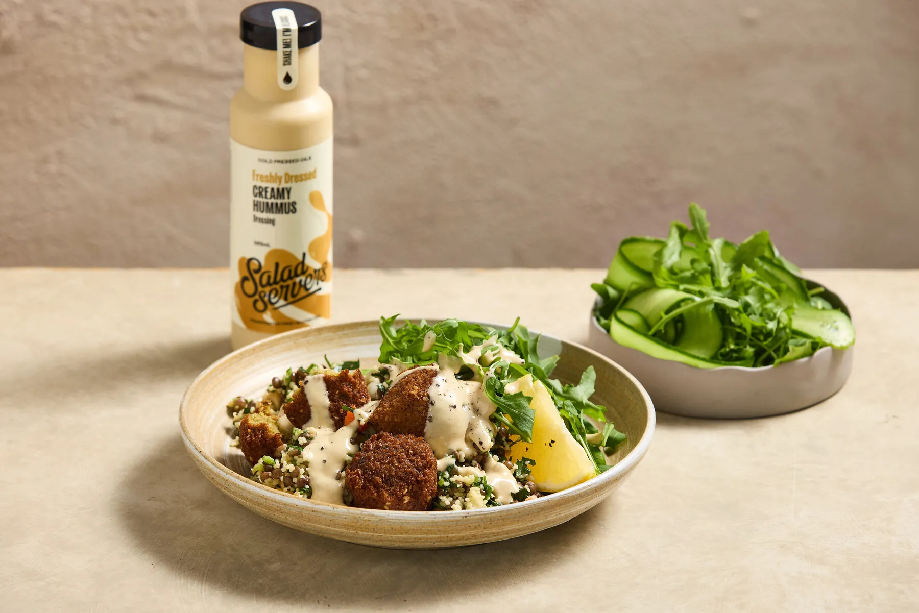 Creamy Hummus dressing drizzled over a fresh dish
